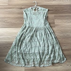 The dress is from a boutique, size medium, color is light green